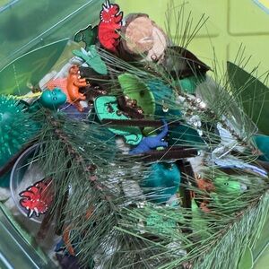 Colorful Dinosaur and Pine Leaf individual sensory bin